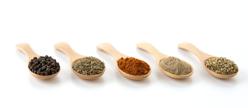 Spices and herbs on white background